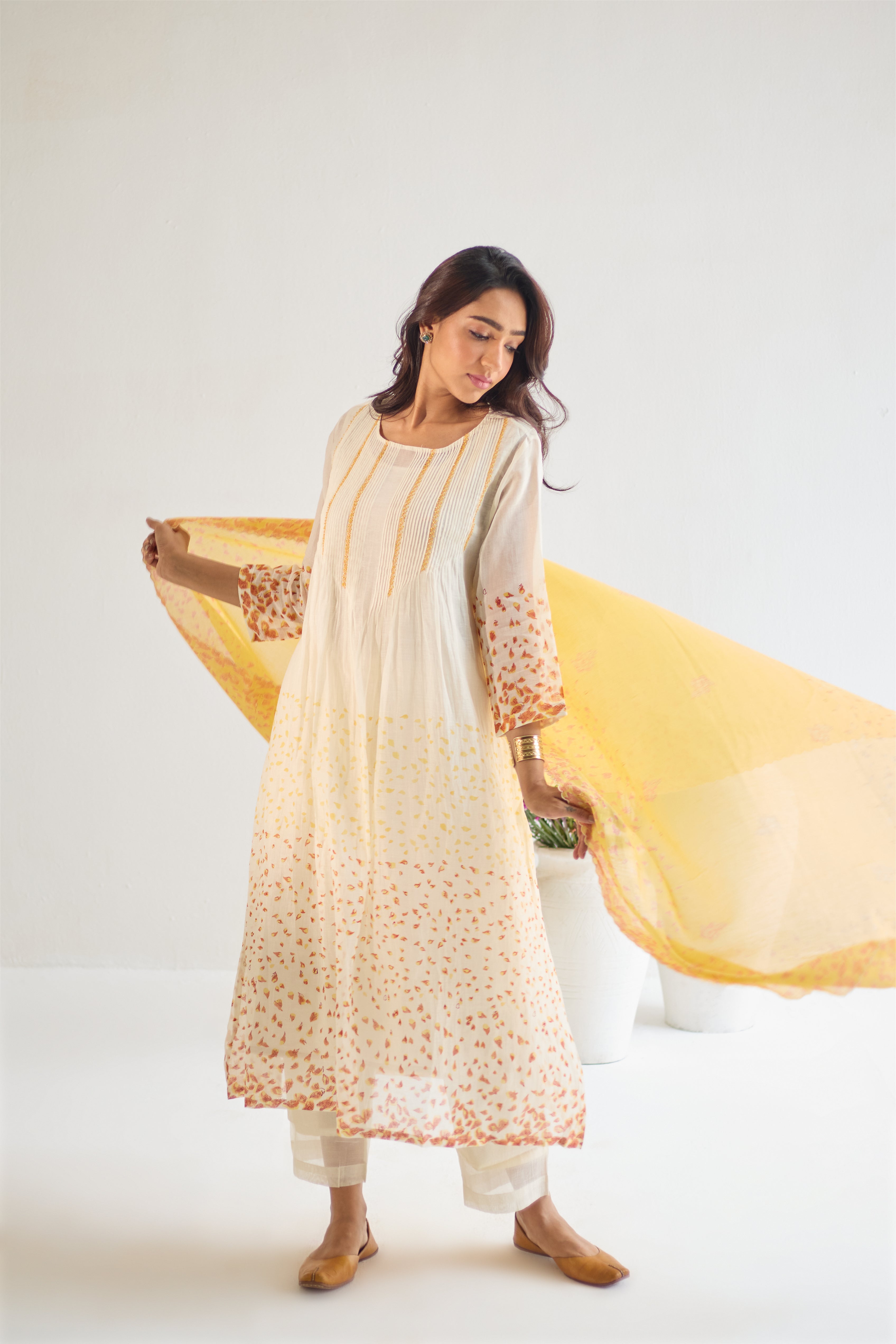 Off white cotton chanderi hand block printed kurta set with all-over multi coloured flower.