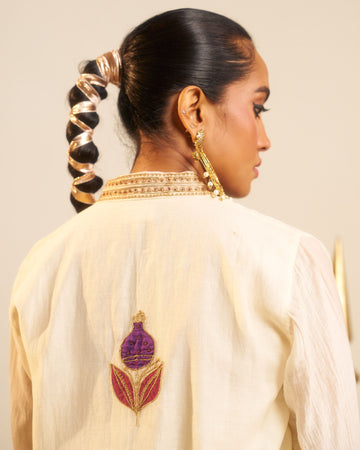 Punica milky white applique hand embroidered chanderi kurta set.
