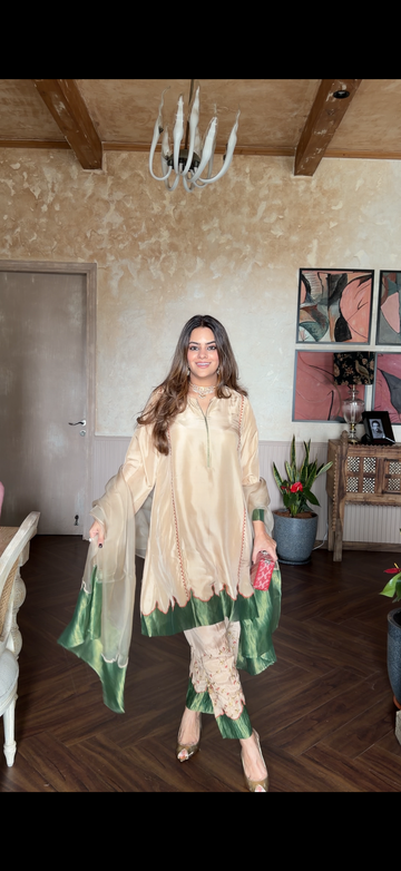 Aakriti Ahuja in Gulbann beige and moss green silk choga set